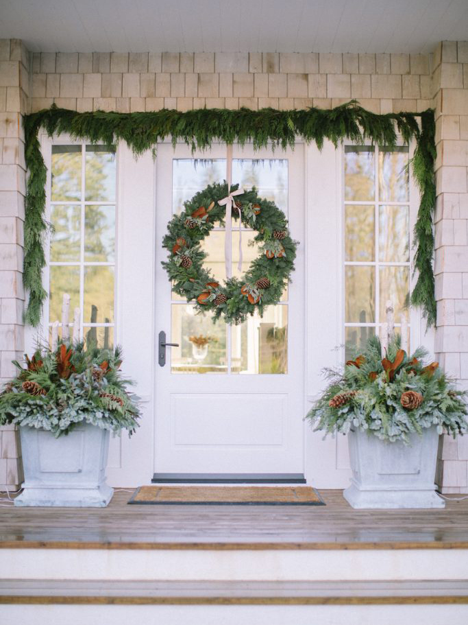 garland wrapped around front door