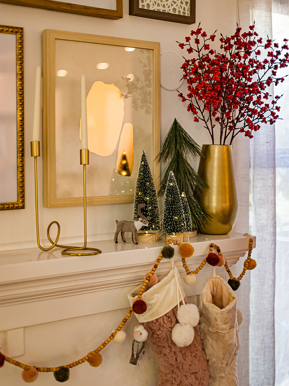 Holiday mantel with pom pom garland