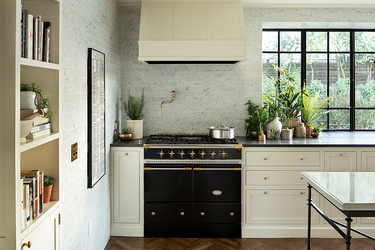 white kitchen with black stove