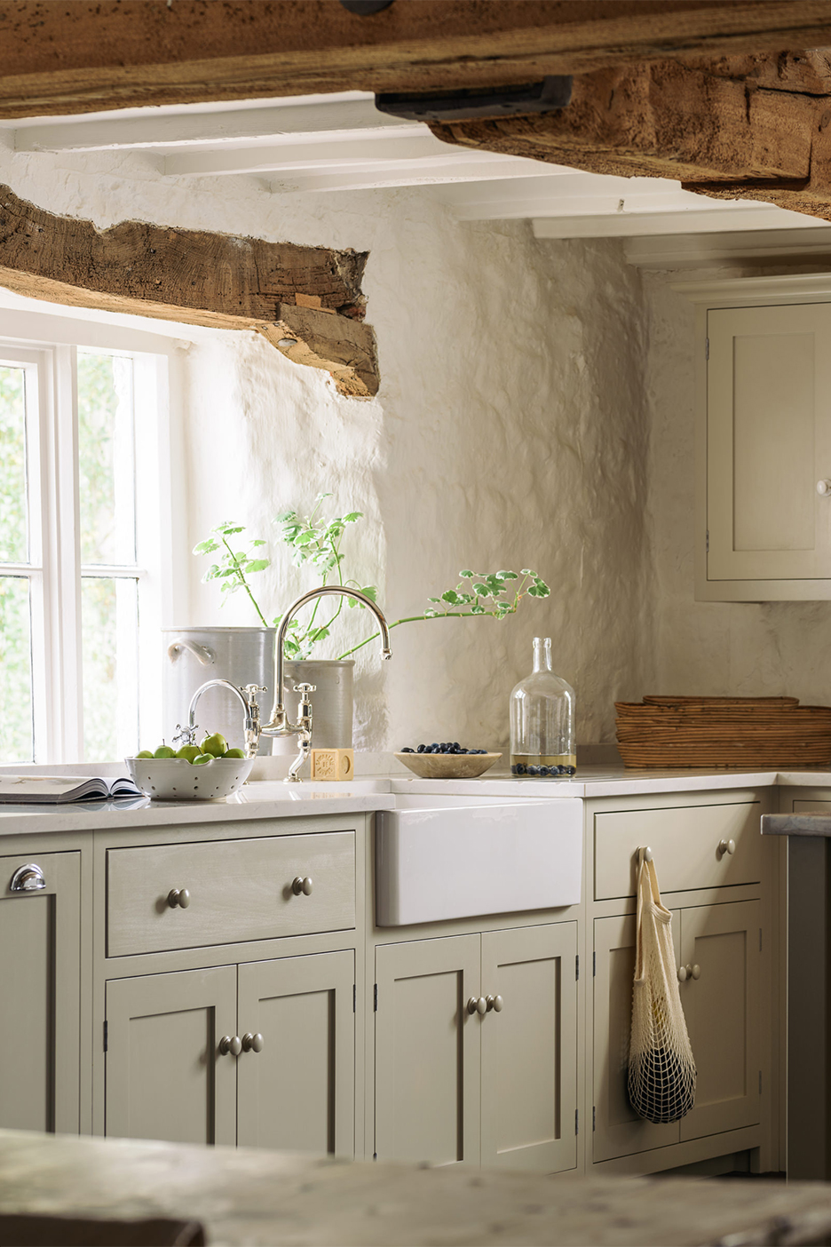 tan kitchen with wood beam ceiling