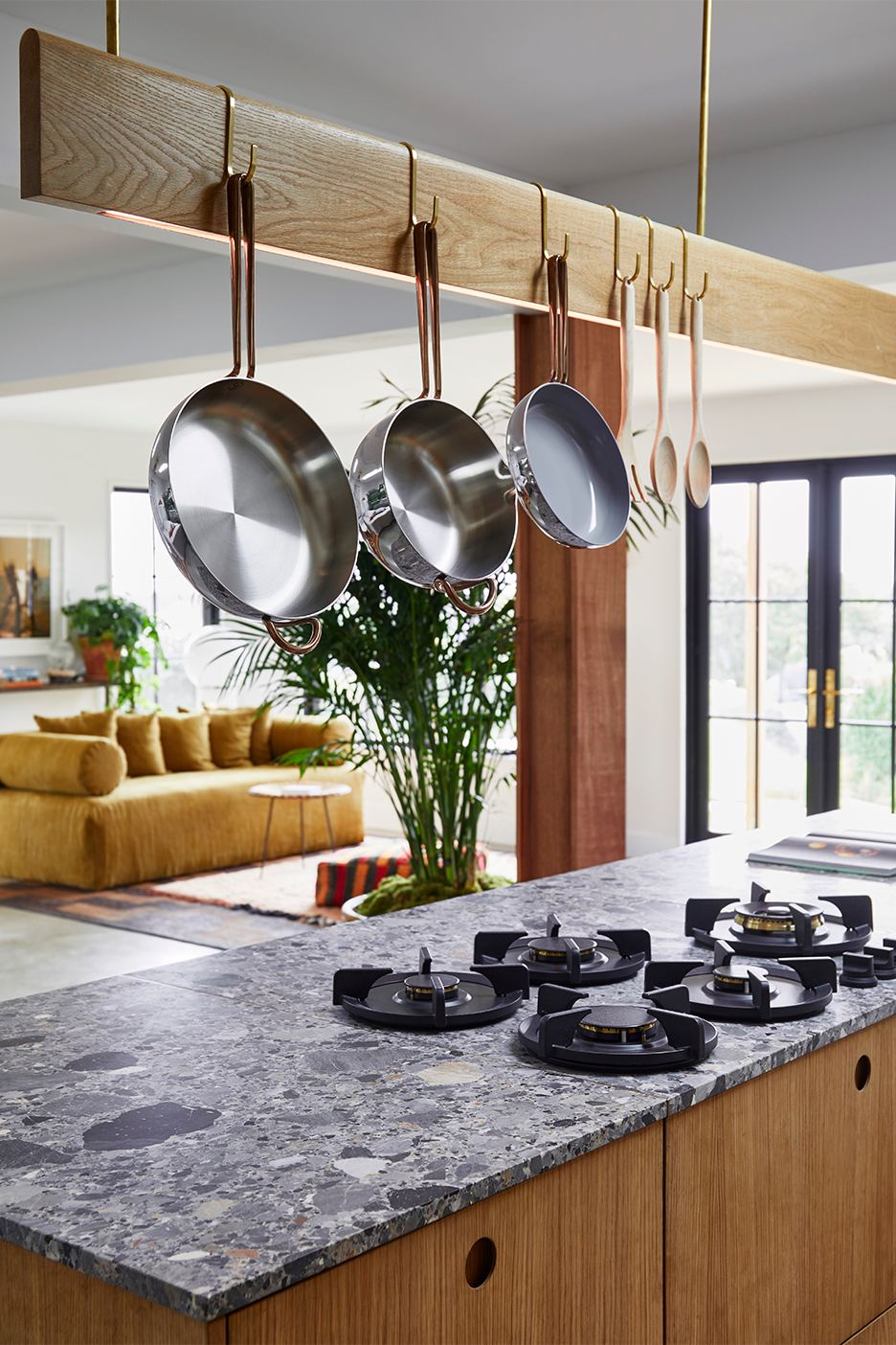 pots hanging from island light