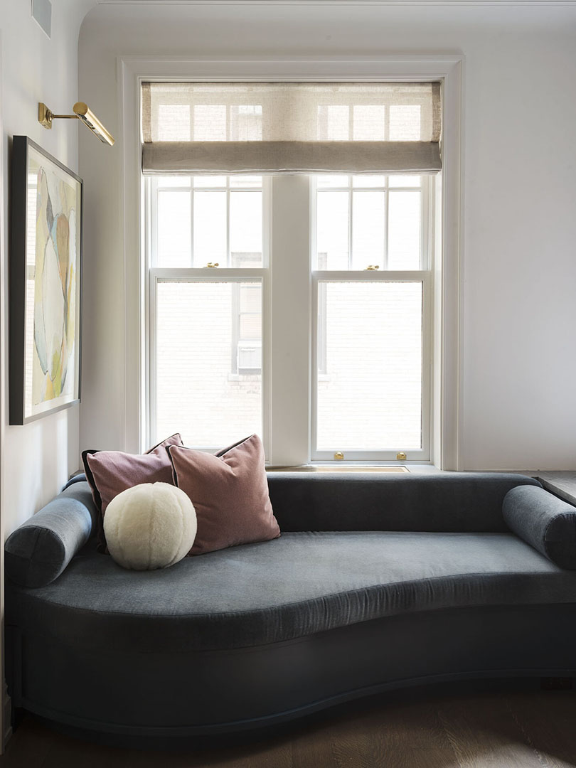 Curved window seat upholstered in charcoal velvet