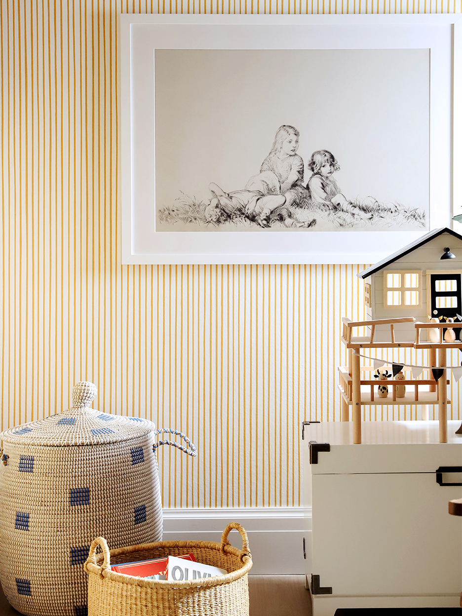 Yellow playroom with striped wallpaper