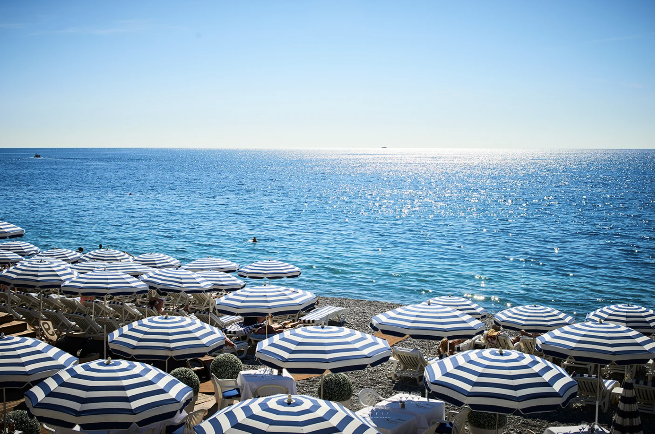 Umbrellas on a crowded beach in south of france