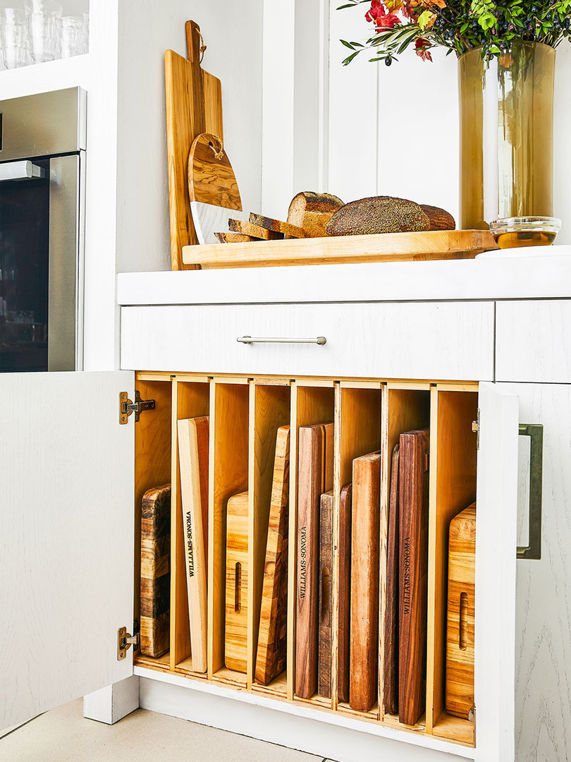 cutting boards in a cabinet