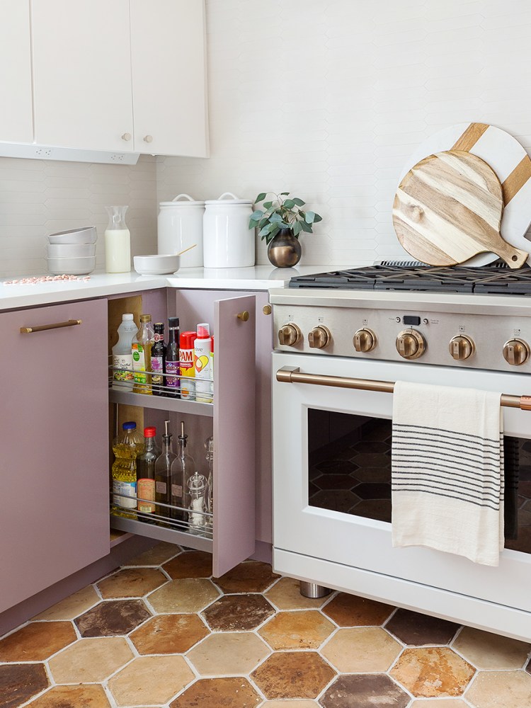 Small kitchen with sliding cabinet door.