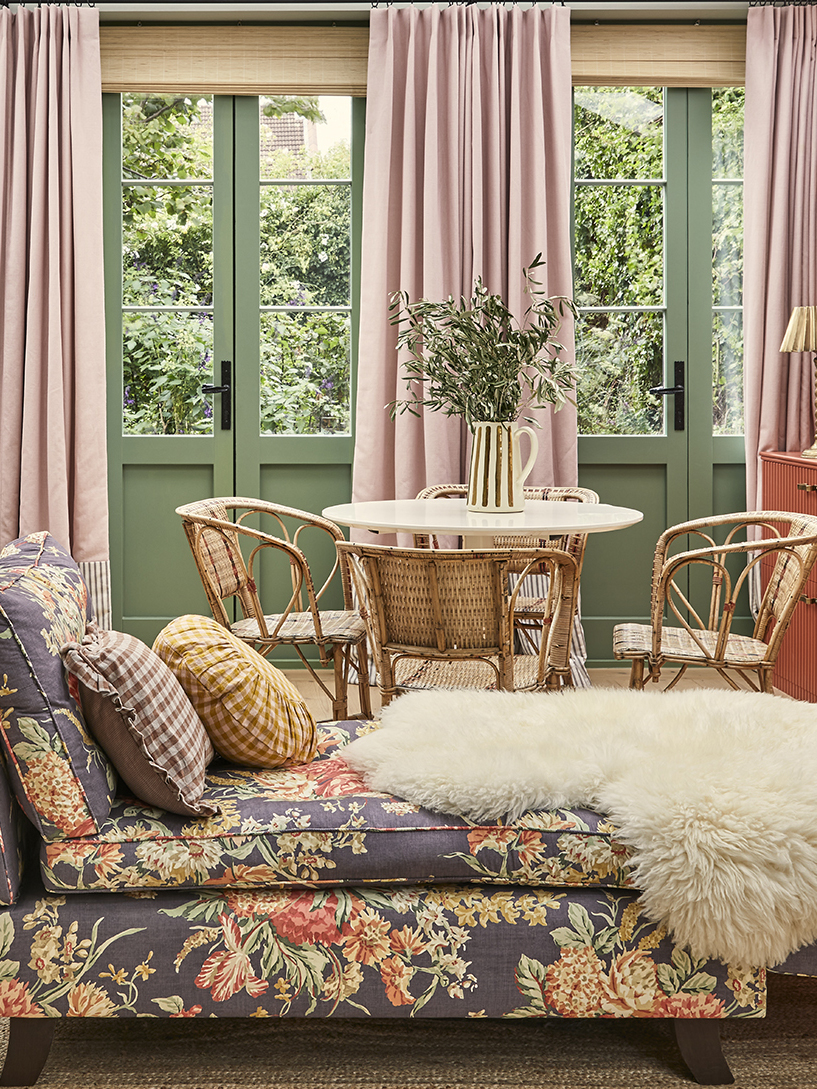 floral couch in front of dining table