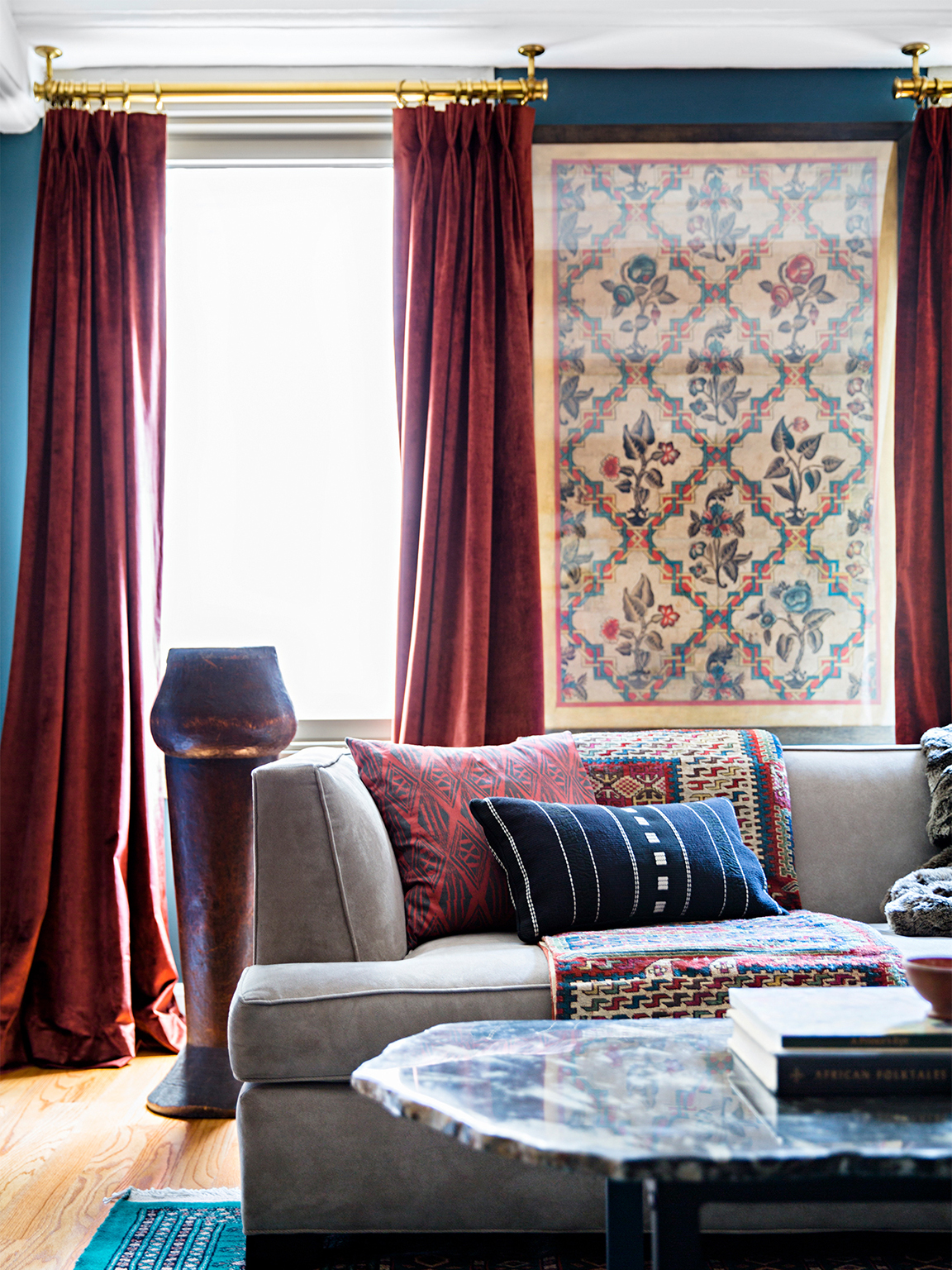 Moody bedroom with burgundy curtains