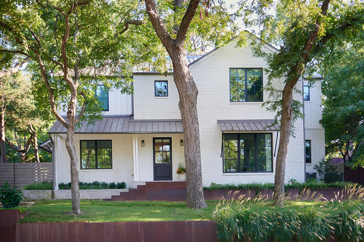 white house with grassy yard