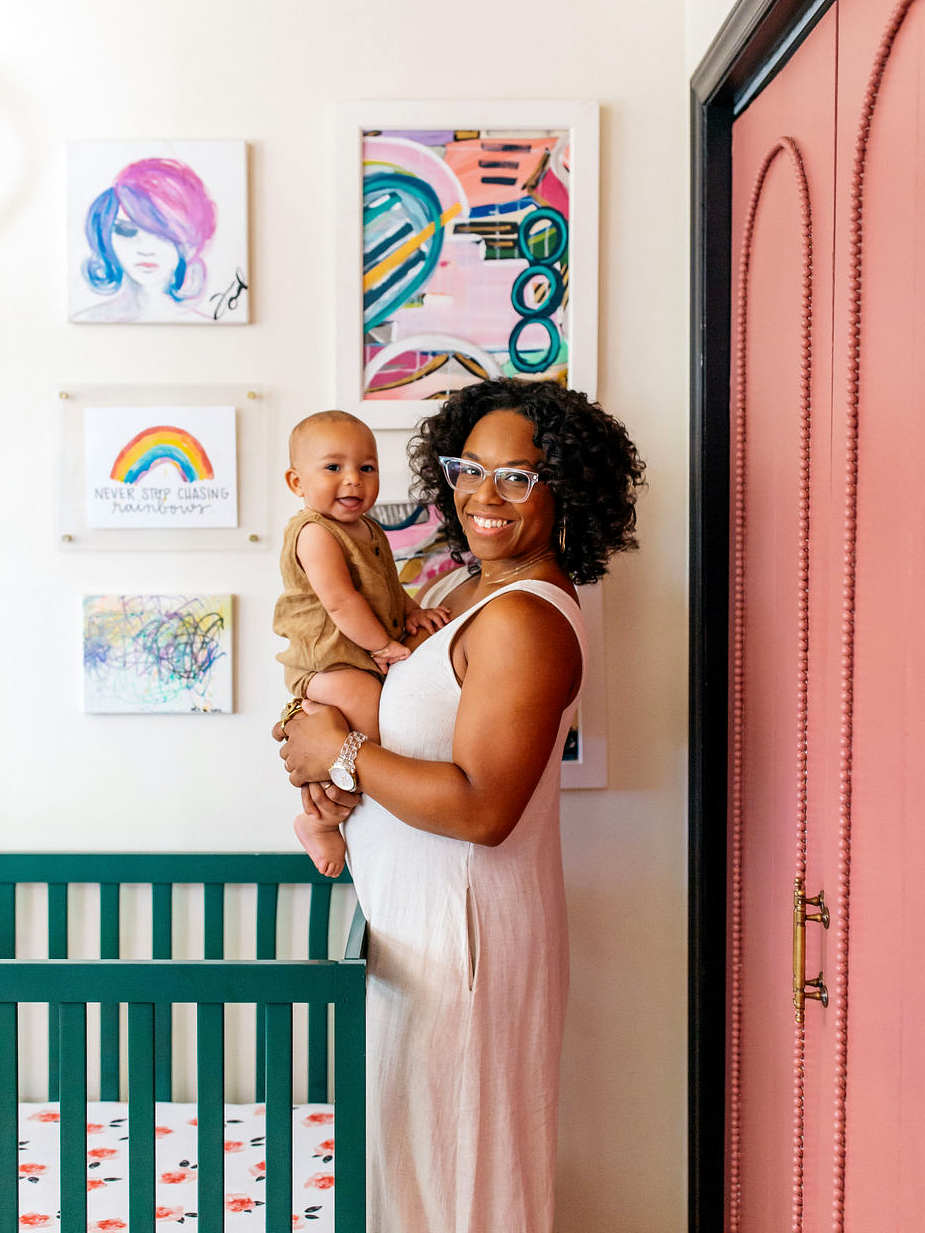 Nursery with green crib and pink closet