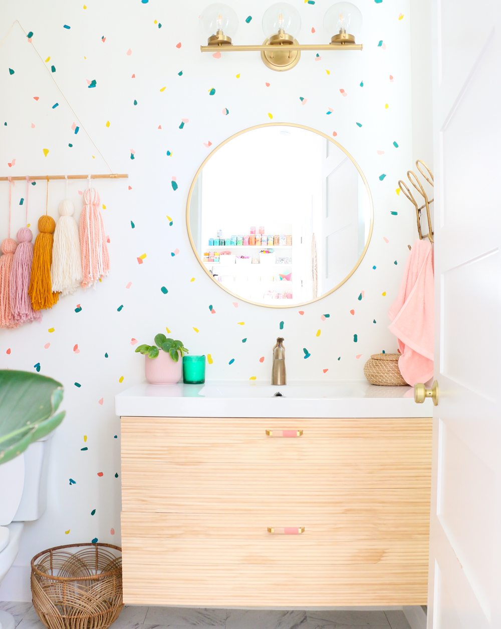 fun bathroom with polka dot wallpaper