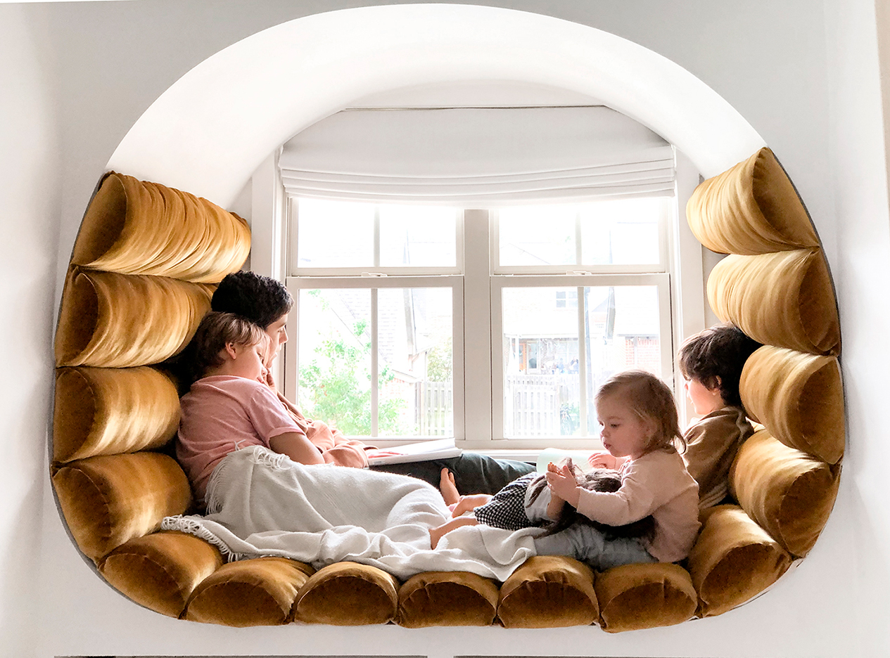 kids in ochre velvet reading nook