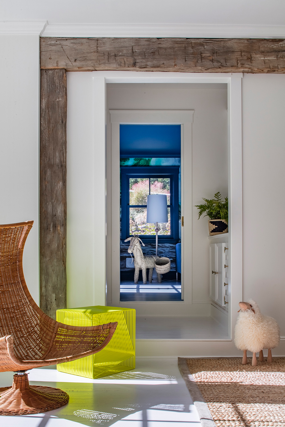 Hallway with sheep stool and rattan chair