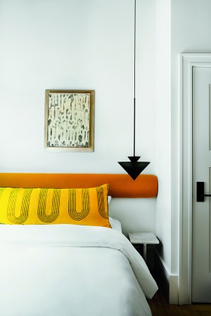 bed with yellow pillow