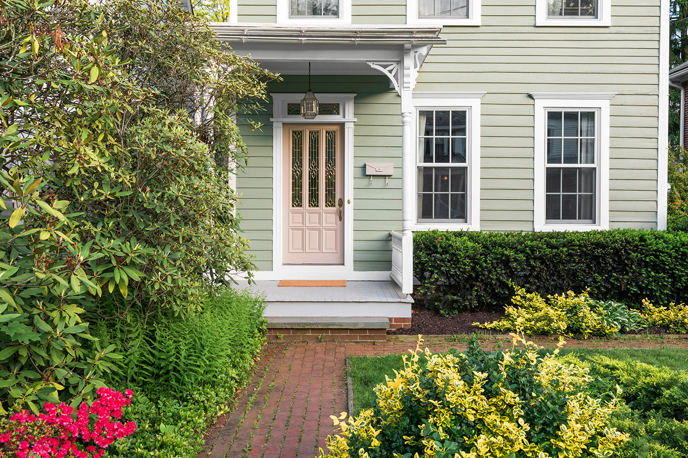 Sage green colonial house