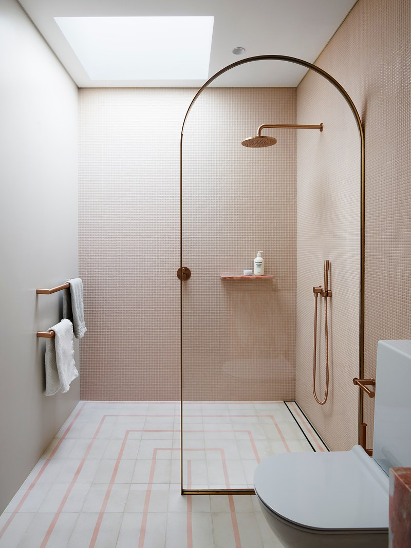 pink bathroom with skylight