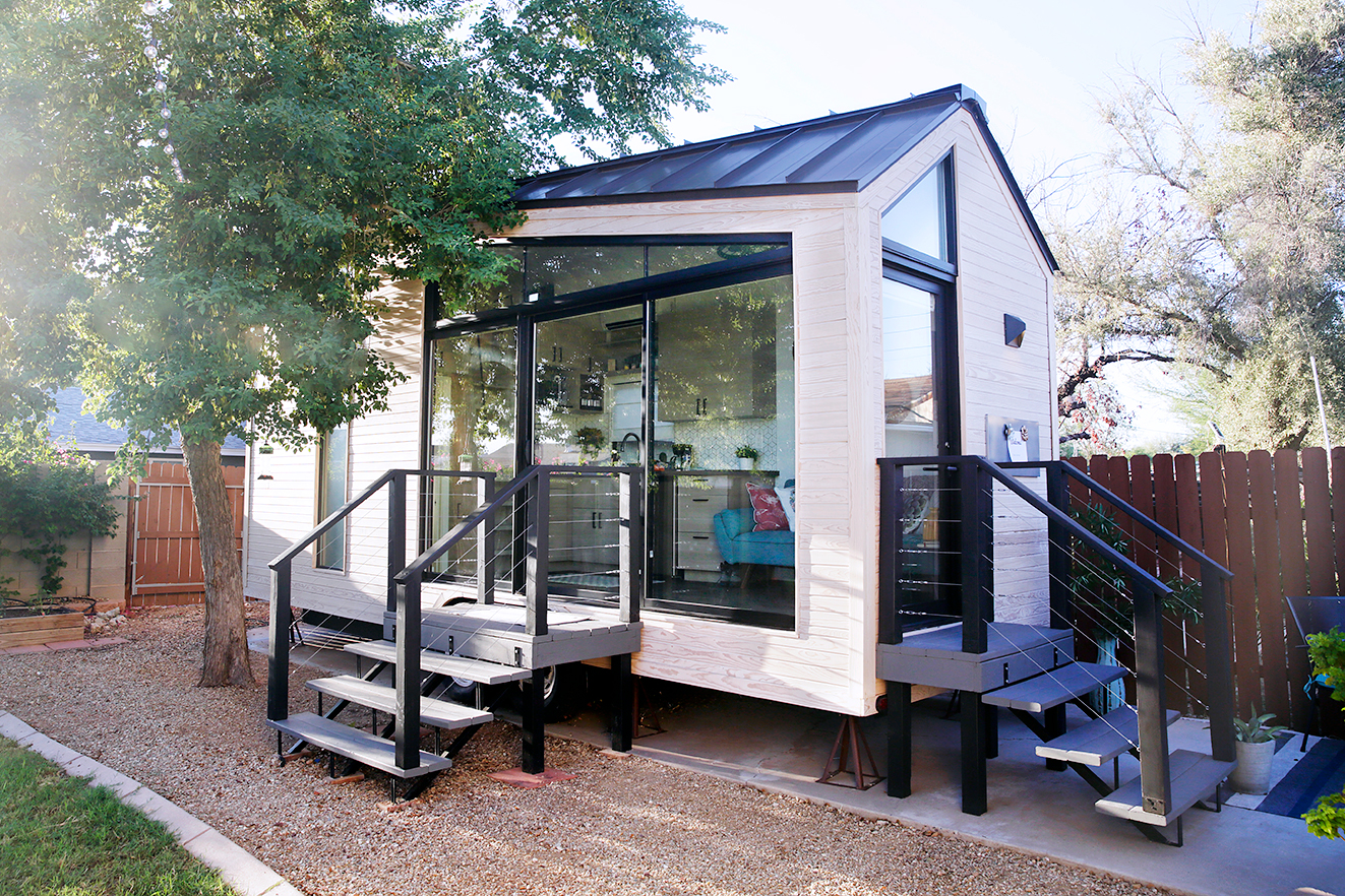 white tiny house with black details