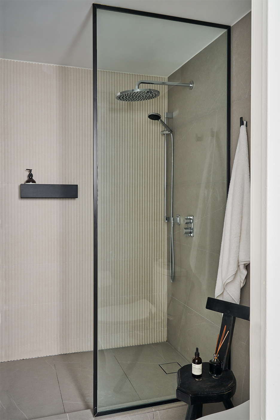 Walk-in shower with striped tile