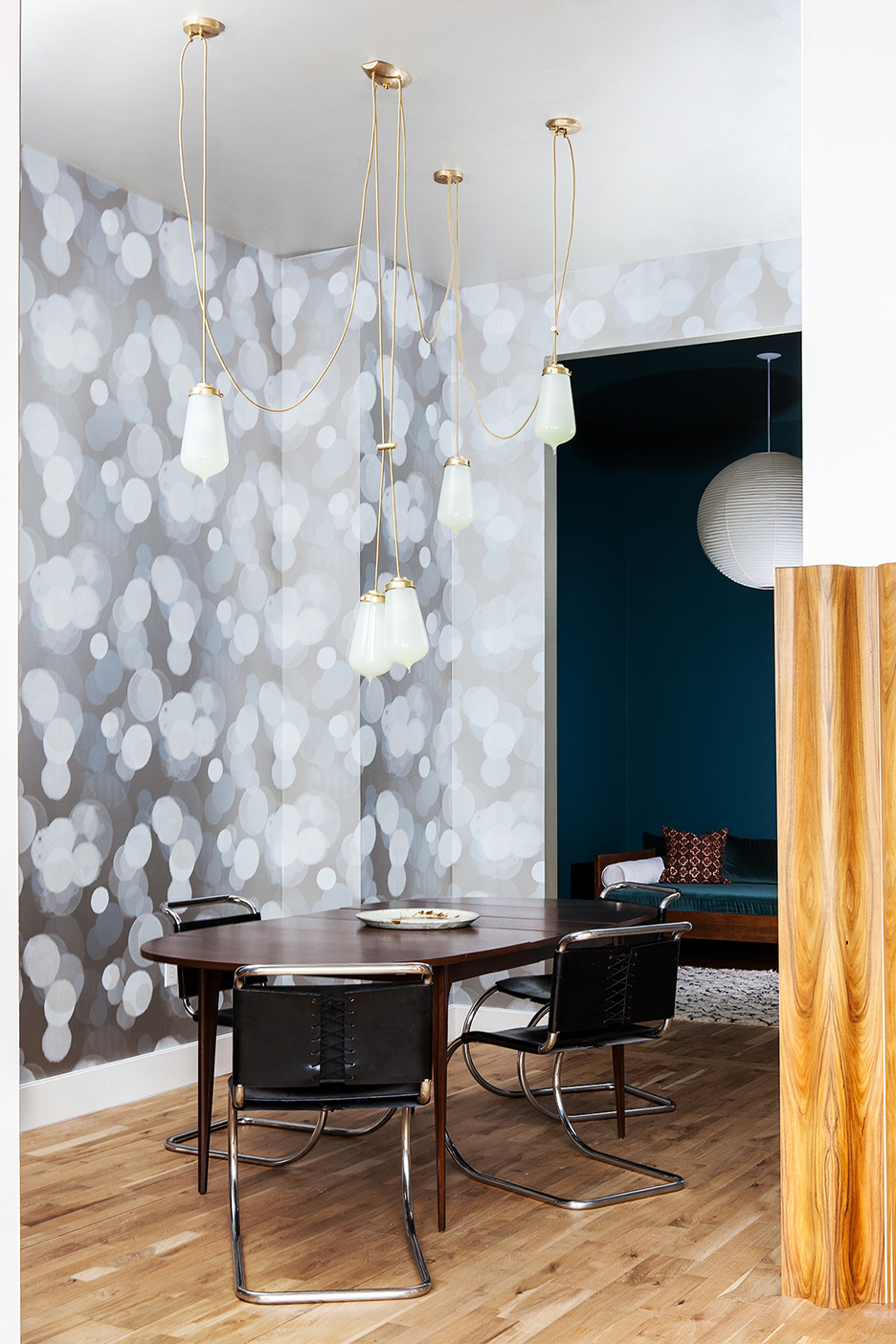 dining room with dramatic bulb pendants