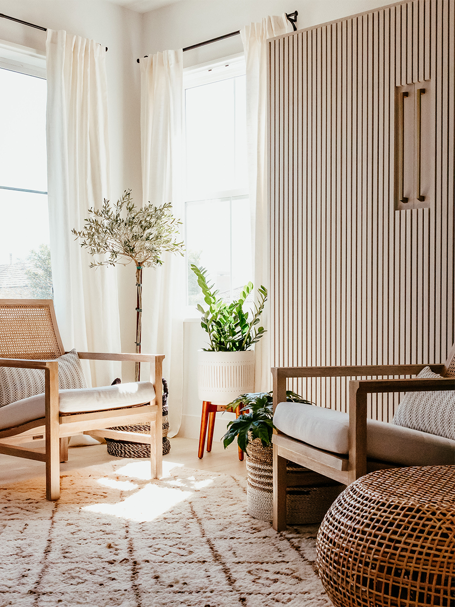 cane chairs next to closed murphy bed