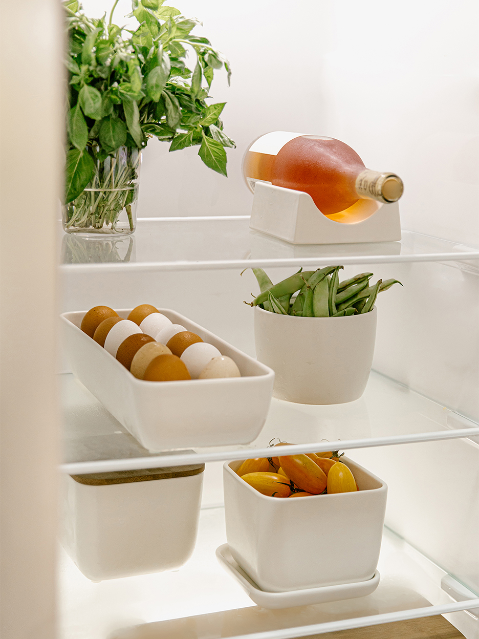 eggs and tomatoes in white bins