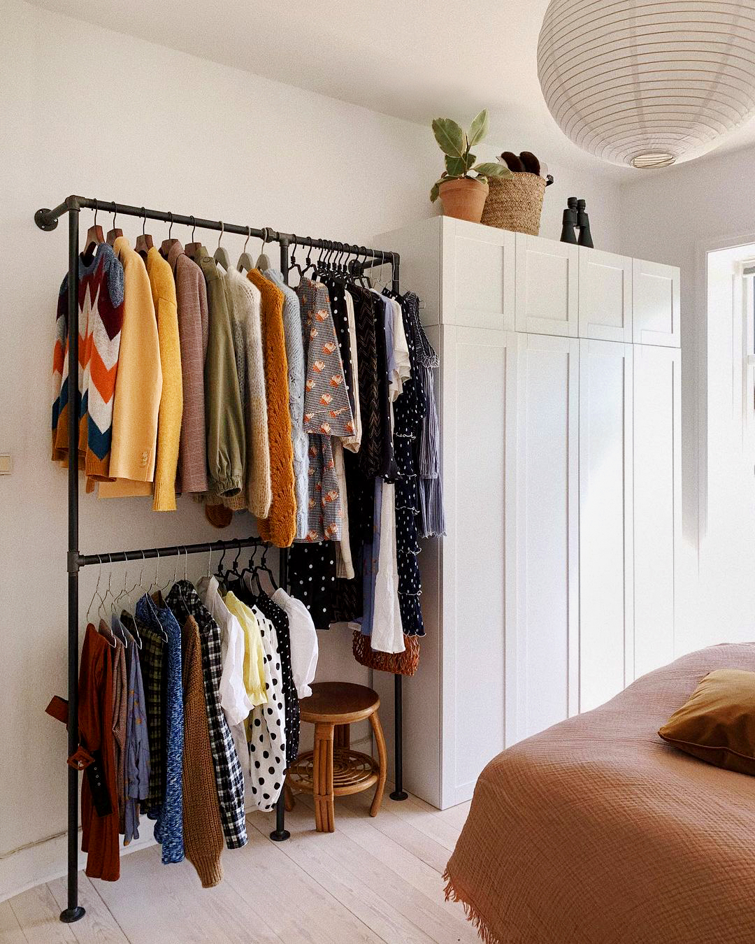 clothing rack next to built in wardrobe