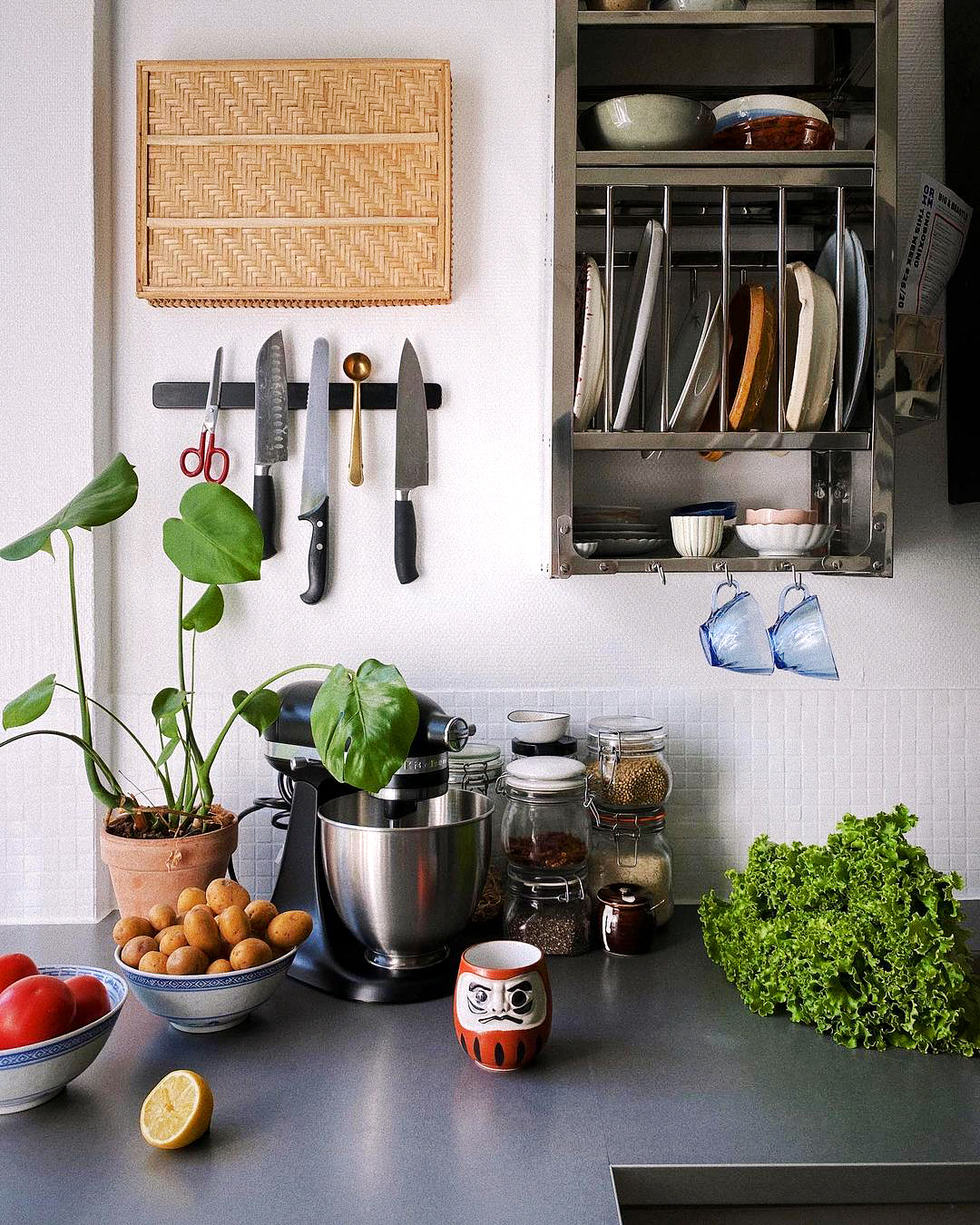 knives and plates mounted on wall