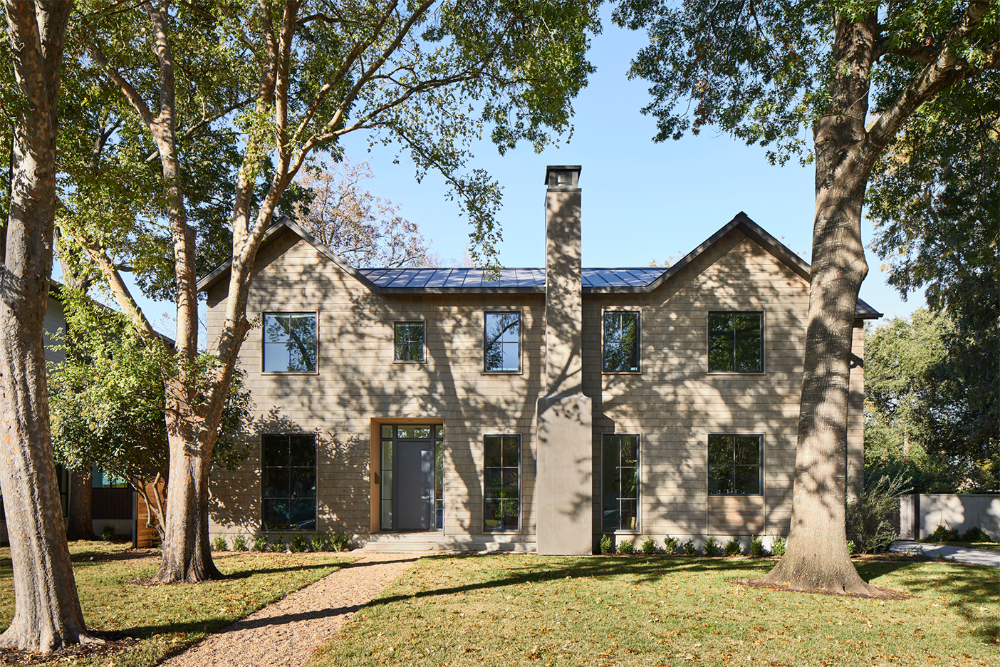 large house surrounded by trees