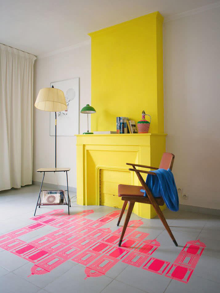 bright yellow fireplace with pink building floor desing