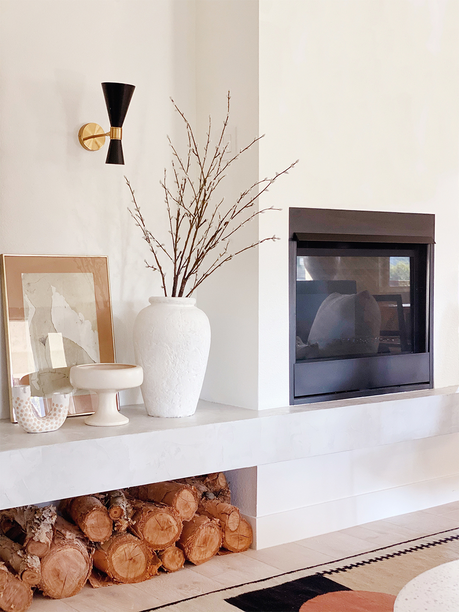 concrete fireplace bench with wood under it