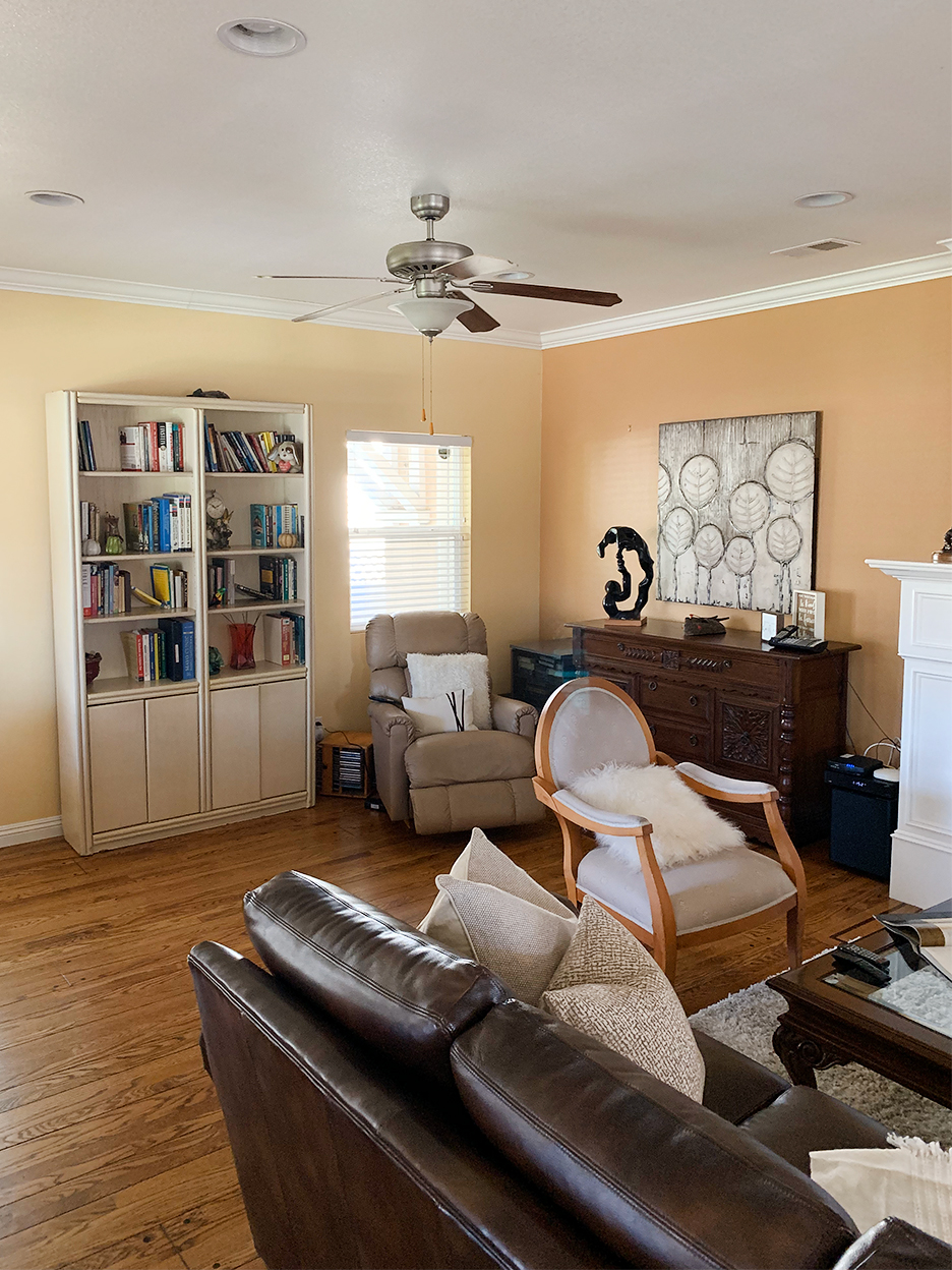 yellow living room with leather sofas