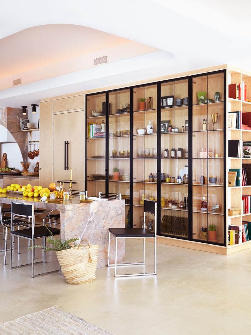 open kitchen with floor to ceiling glass cabinets