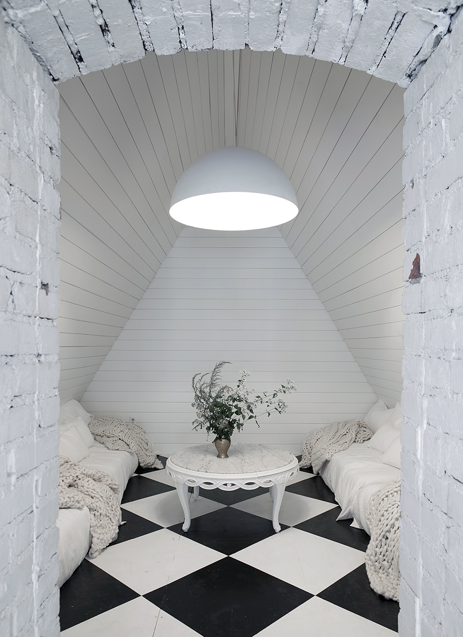 attic lounge space with checkered floors