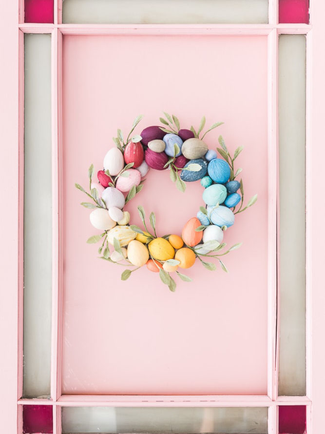 egg wreath on pink door