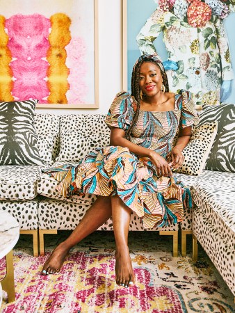 autumn adeigbo on cheetah-print sofa