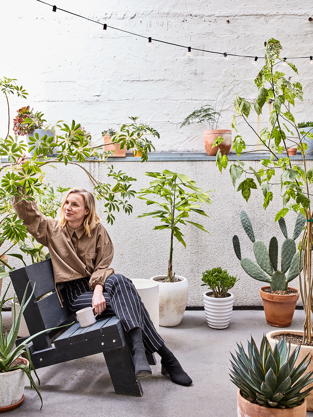 Women on patio surrounded by plants