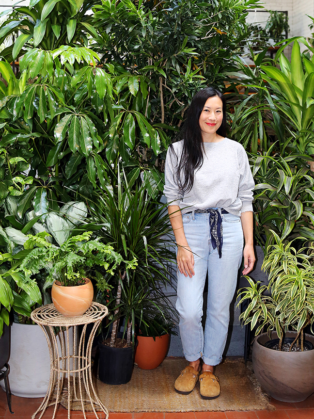 Woman standing in a plant store