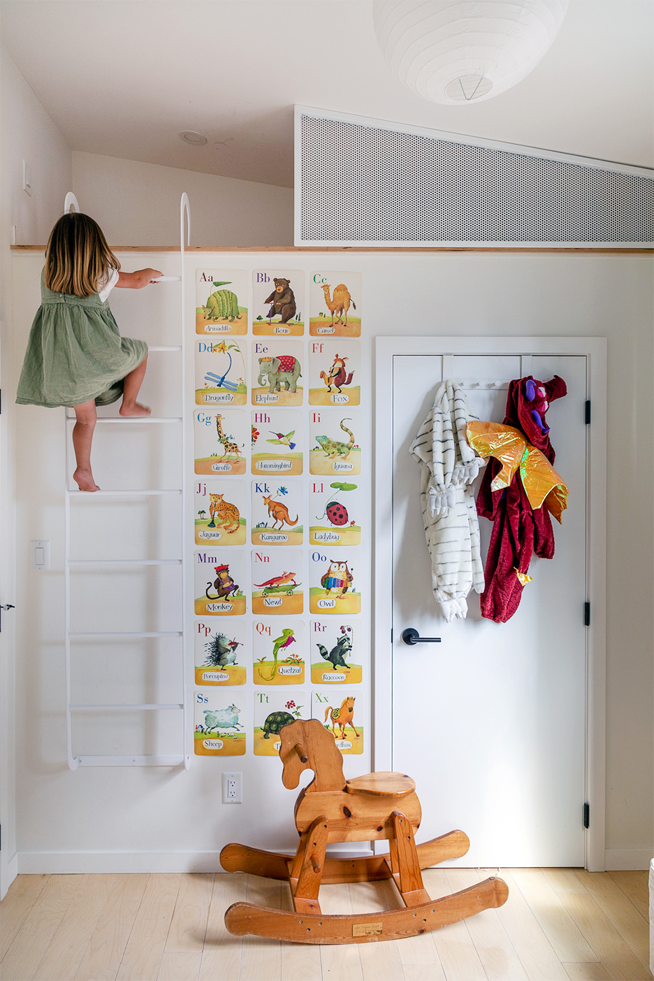 girl crawlign up a ladder