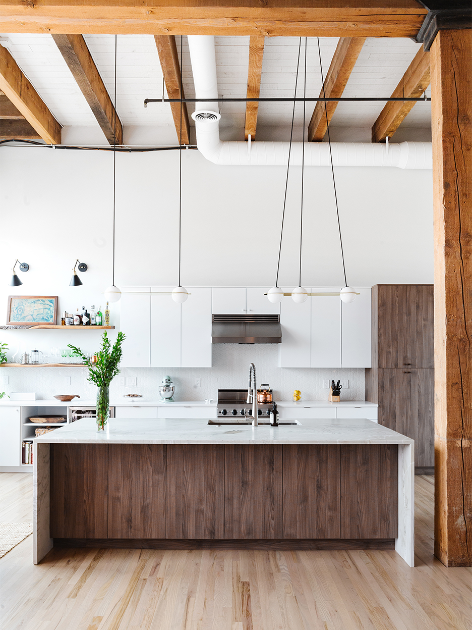 white kitchen with high ceiling beams