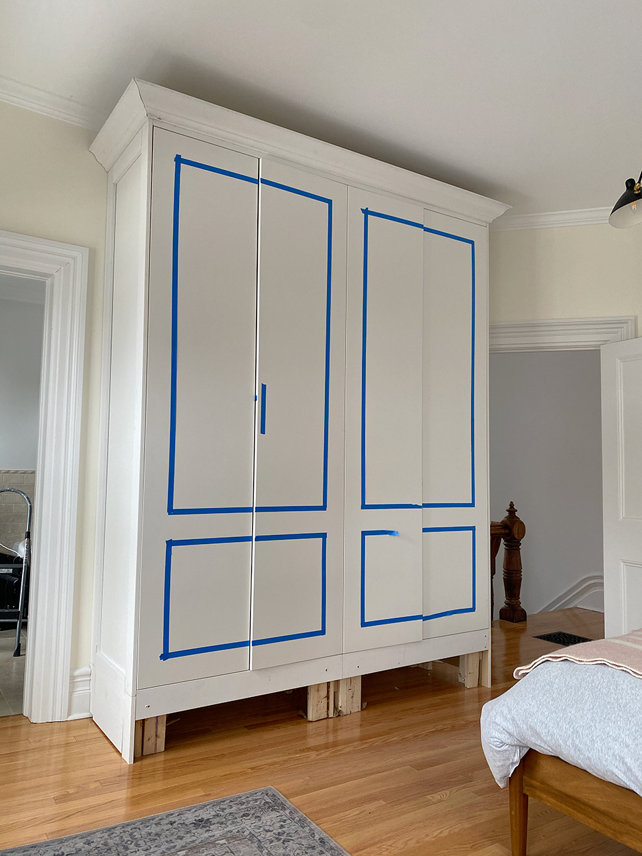 closets with blue tape on the panels