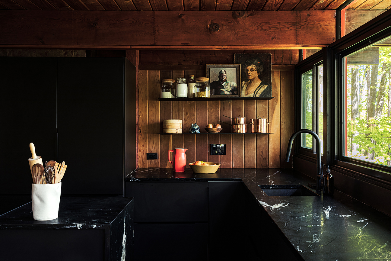 black and wood kitchen with floating shelves