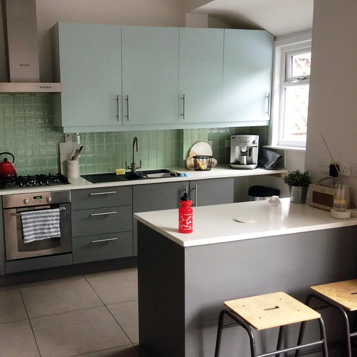 kitchen with teal cabinets