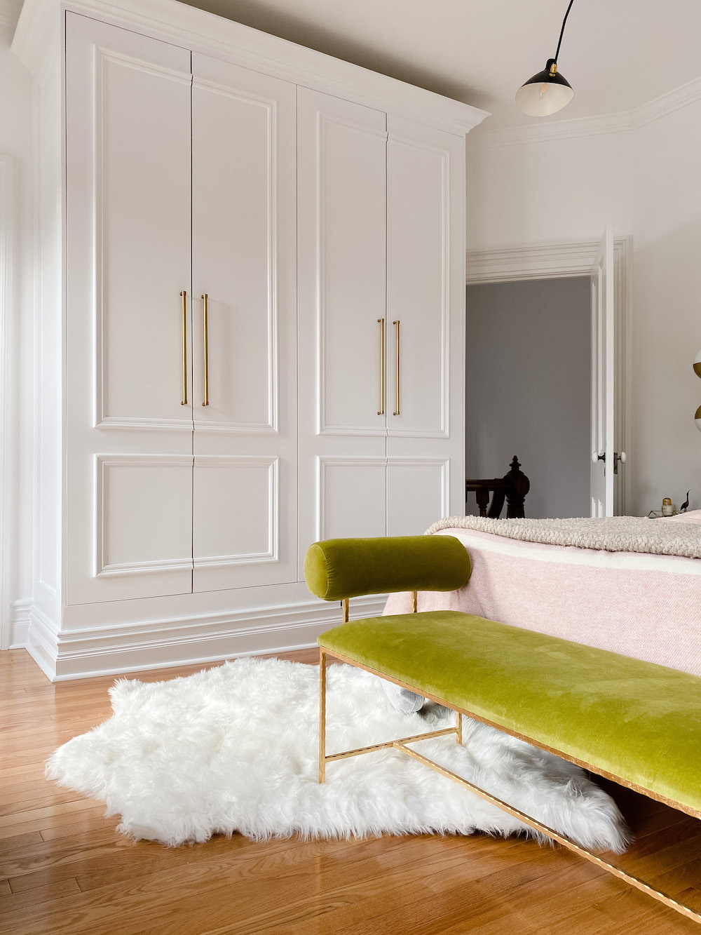 styled bedroom with big white closet