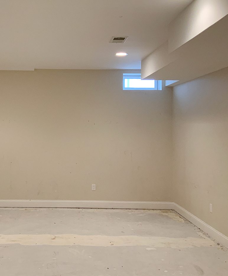 beige empty room with concrete floor