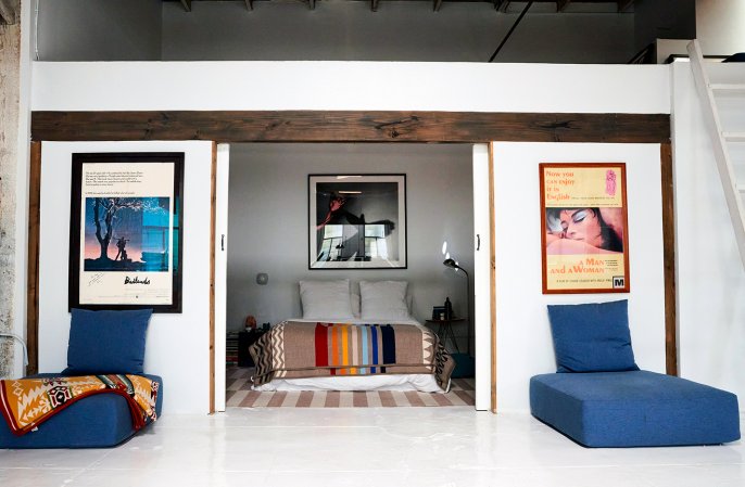 bedroom with floor cushions outside the door