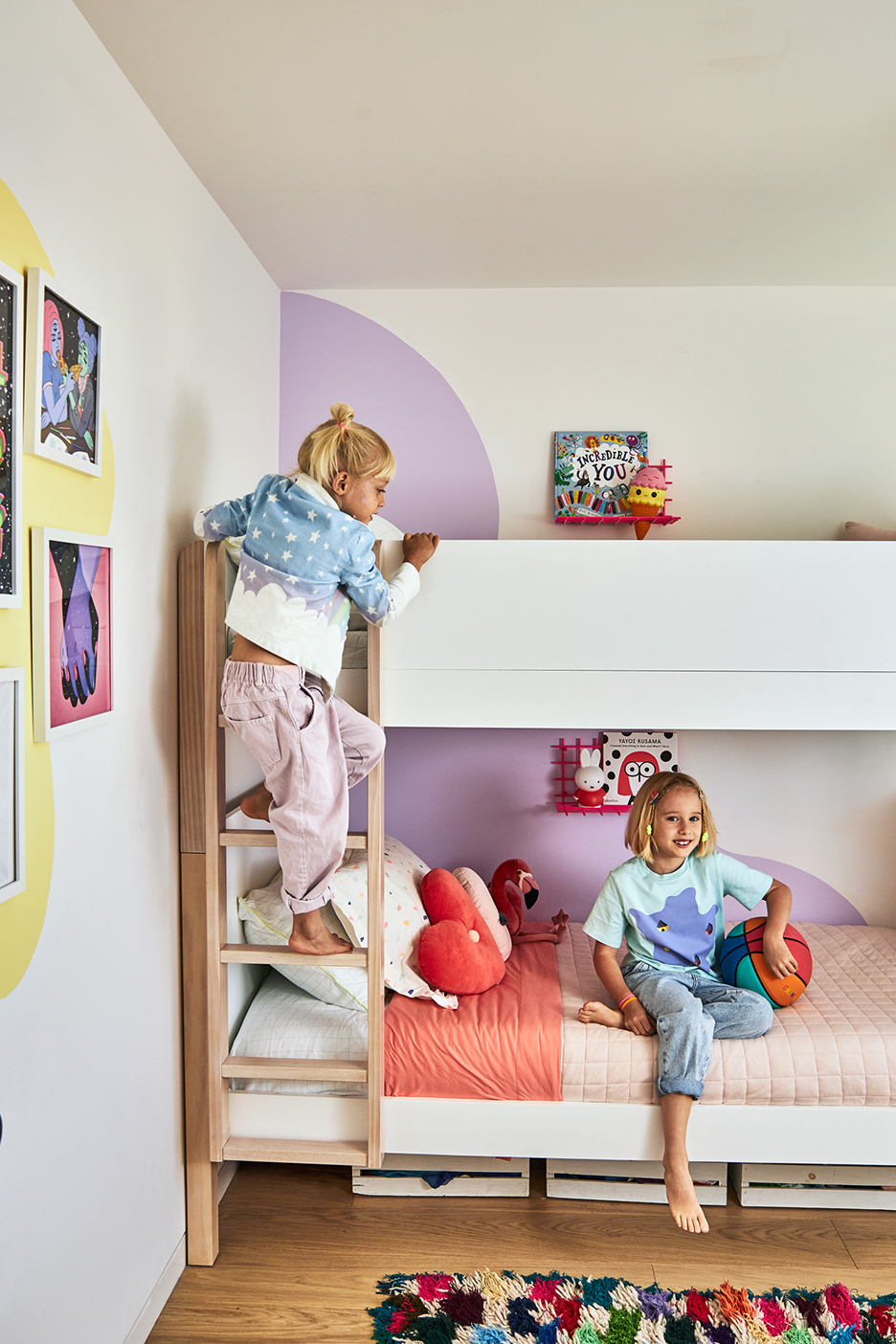 girls climbing on bunk bed