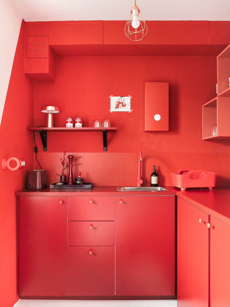 bright red tiny apartment kitchen