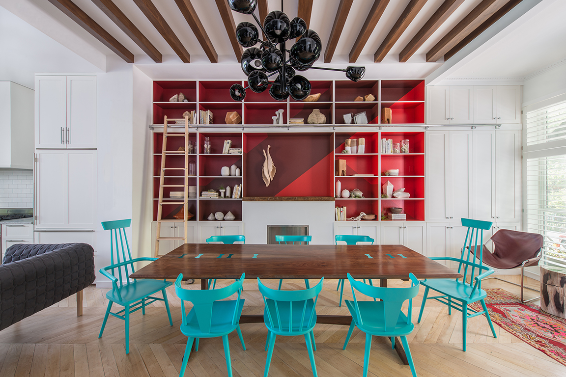 blue dining room chairs and red built in bookcase