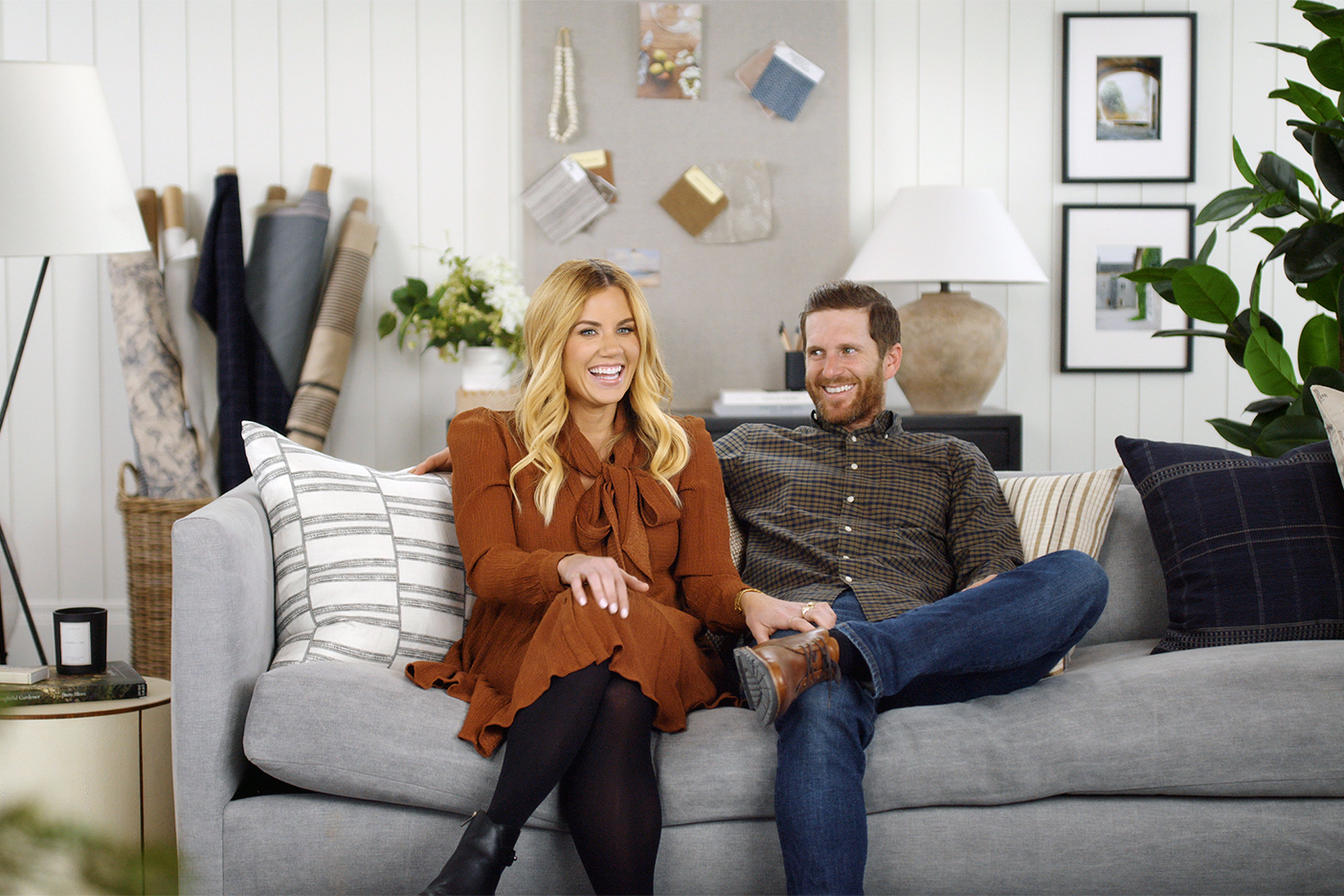 man and woman sitting on couch