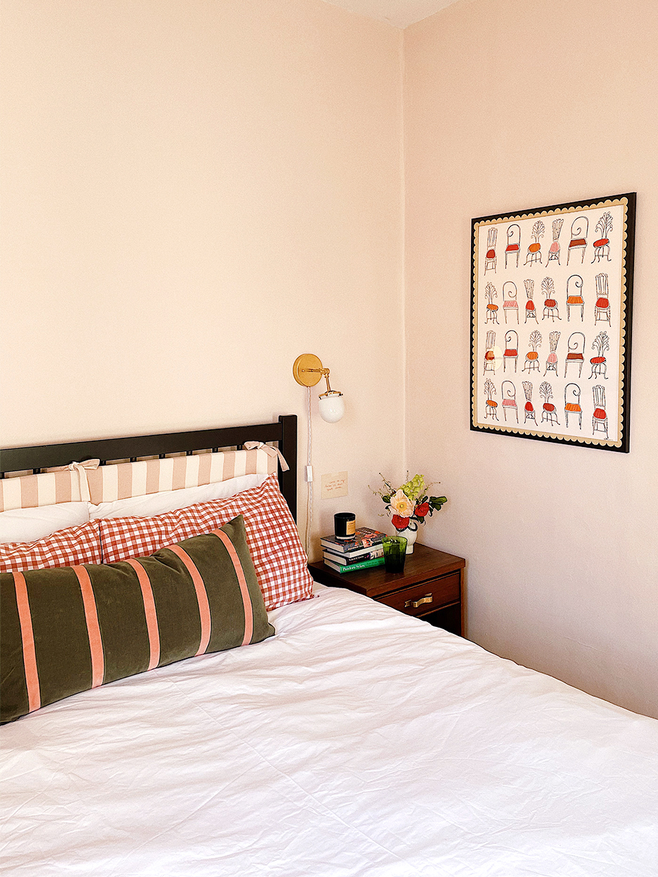 bed with striped and checkered pillows